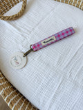 Llavero bicolor fucsia y lila